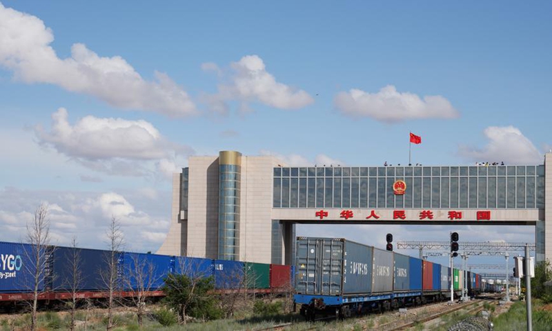 This photo taken on June 14, 2025 shows an inbound China-Europe freight train (R) and an outbound one at the border gate at Erenhot Port in north China's Inner Mongolia Autonomous Region. (Xinhua/Yin Dongxun)