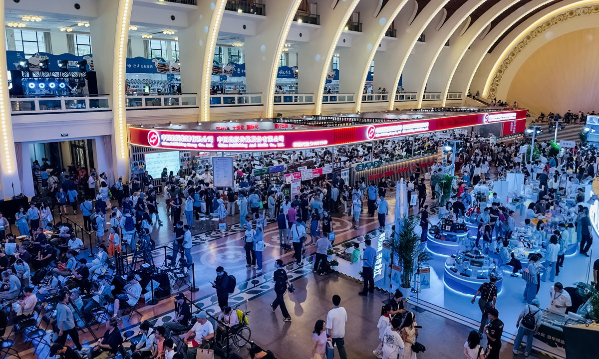 Visitors browse books and take part in activities at the 2026 Shanghai Book Fair at the Shanghai Exhibition Center in Shanghai on August 12, 2026. The book fair, which runs through August 18, features a record 1,420 reading-related activities, up 12.1 percent from the previous edition, the organizers said. Photo: IC