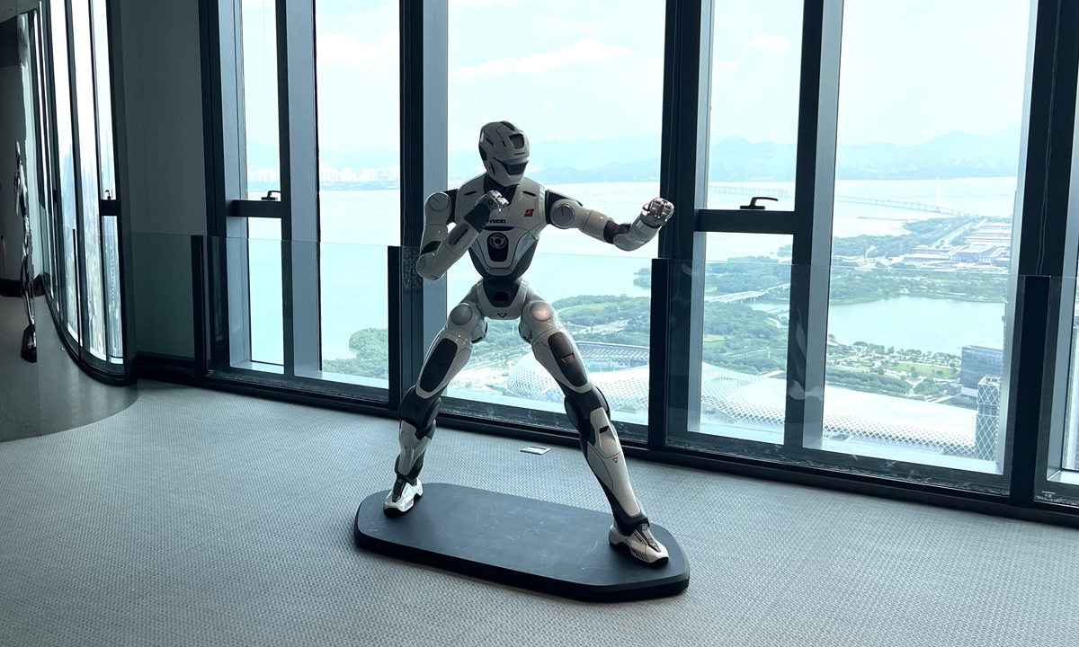 A display of a humanoid fighting robot at robotics firm EngineAI's intelligent manufacturing base in Robot Valley in Shenzhen, South China's Guangdong Province, on August 5, 2026. Photo: Li Xuanmin/GT