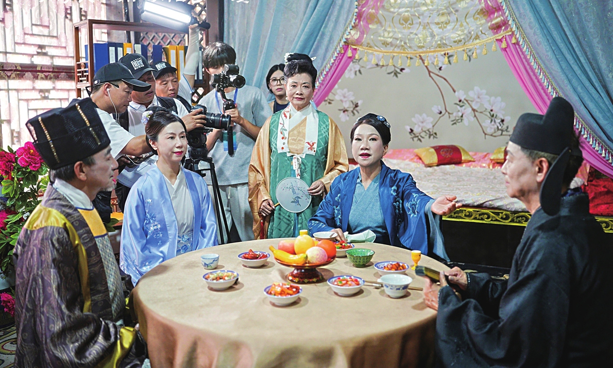 Senior tourists shoot an ancient-China setting short drama in Hengdian World Studios, East China's Zhejiang Province, on August 7, 2026. Photo: Courtesy of Hengdian World Studios