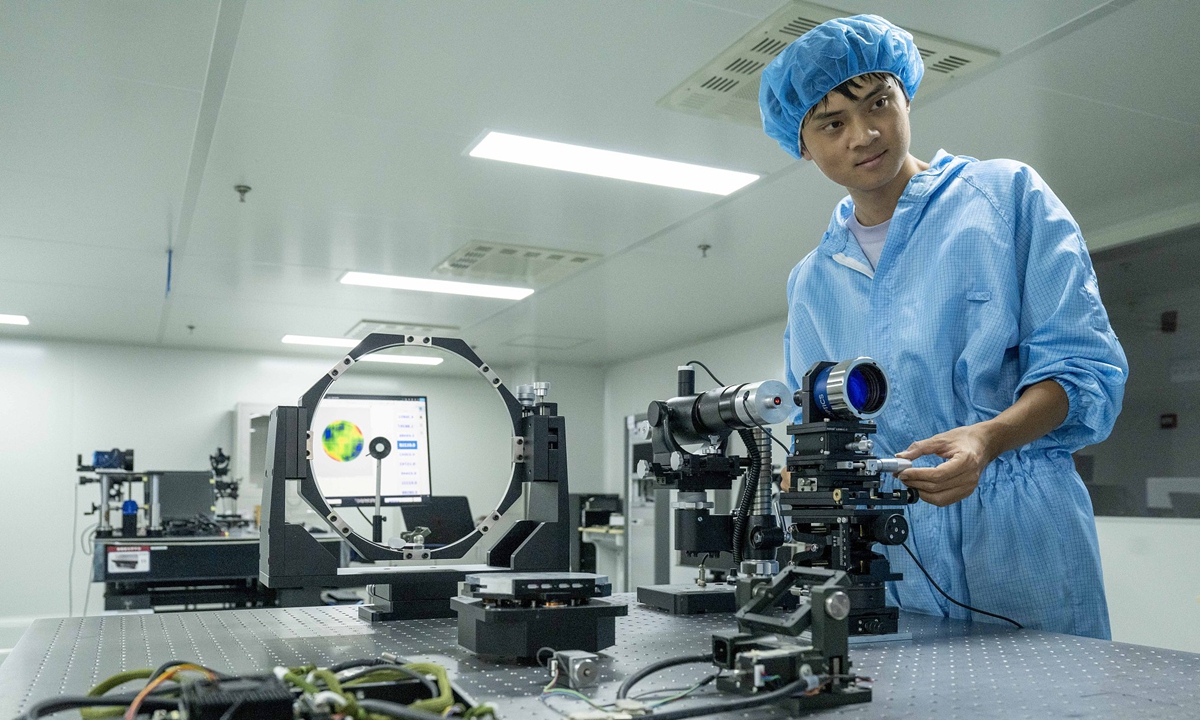 A researcher uses a wavefront sensor to measure the phase distribution of an optical wave at a company in the Luyang Economic Development Zone, Hefei, East China's Anhui Province, on August 14, 2026. In recent years, the development zone has focused on developing three emerging industries: intelligent sensors, software information technology, and high-end instruments. Photo: VCG