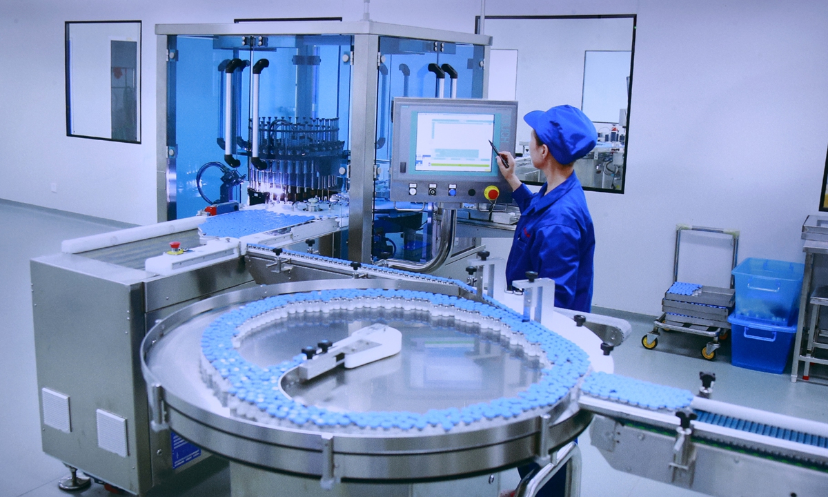 A worker operates a machine at a pharmaceutical company in Yanji, Northeast China's Jilin Province on August 11, 2026. Photo: VCG