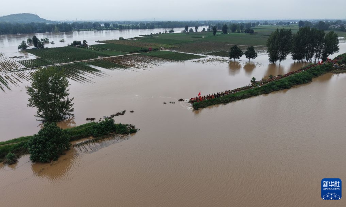 An aerial view of emergency repair operations at a levee breach along the Beiru River in Pingdingshan, Central China's Henan Province, on August 13, 2026. Photo: Xinhua