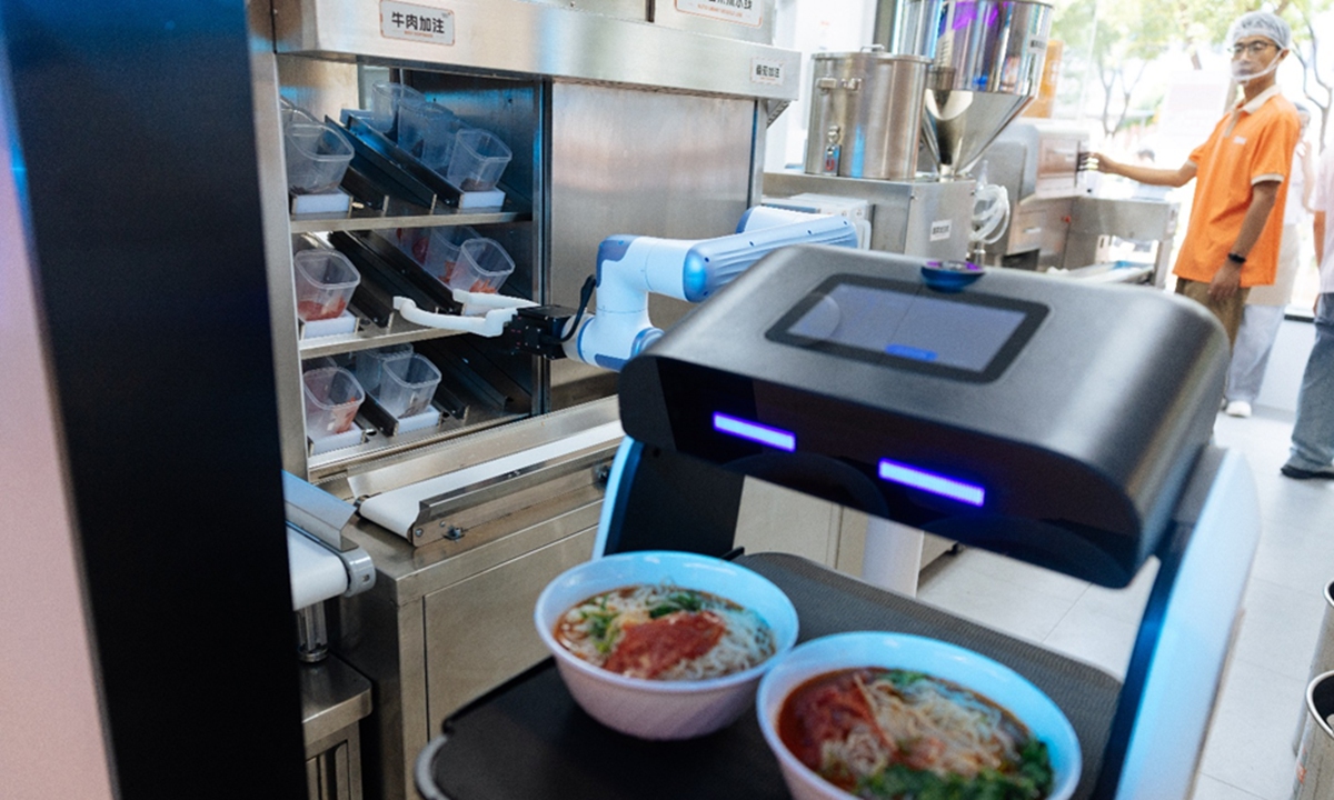 globaltimes.cn - Tao Mingyang - Robot-run noodle shop begins trial in Beijing, with robots taking orders, cooking and serving
