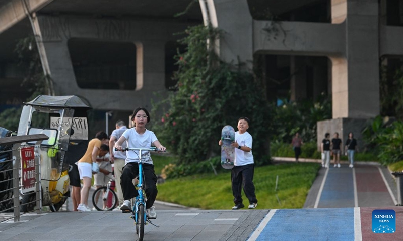 Residents exercise under a bridge in Liangjiang New Area, southwest China's Chongqing, Aug. 10, 2026. In recent years, Liangjiang New Area has transformed vacant spaces under bridges into spaces for exercise and recreation. Photo: Xinhua