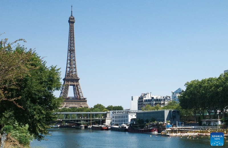People swim in the Seine River during a heatwave in Paris, France, Aug. 14, 2026. (Xinhua/Wu Huiwo)