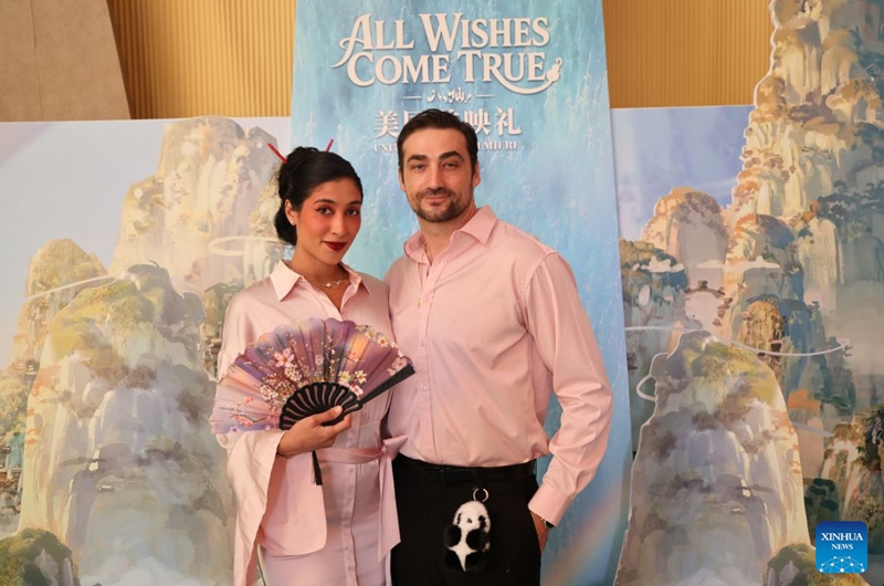 Moviegoers pose for a photo at the North American premiere of the Chinese animated film All Wishes Come True in Los Angeles, California, the United States, Aug. 13, 2026. Chinese animated fantasy-comedy All Wishes Come True held its North American premiere Thursday night in Los Angeles, ahead of its theatrical release across the United States and Canada on Friday. (Photo by Zeng Hui/Xinhua)