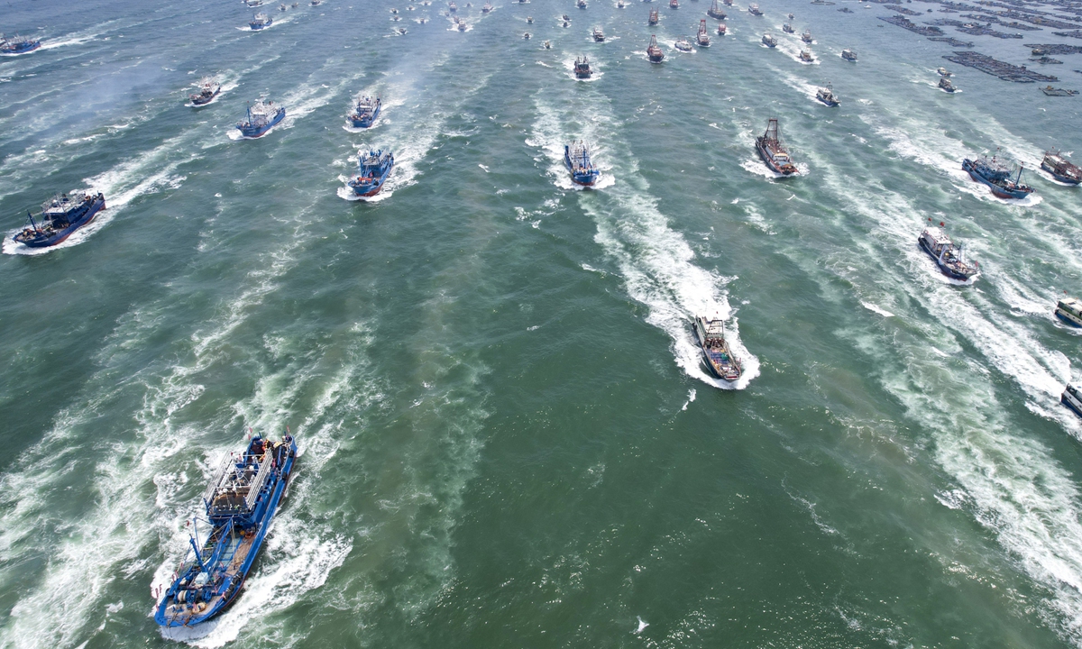 Drone image shows fishing boats depart from the Zhapo National Central Fishing Port in Yangjiang, South China's Guangdong Province, after the official lifting of the fishing ban. The fishing season of the South China Sea kicked off at noon on August 16, 2026, after this summer's three-and-a-half-month fishing ban. Photo: VCG