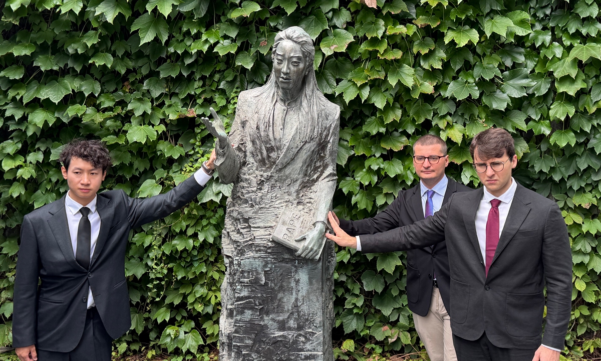 Zhong Haosong (left), Bastien Rata (center) and Marcus Dretz (right) visit the Memorial Hall of the Victims in Nanjing Massacre by Japanese Invaders in Nanjing, East China’s Jiangsu Province, on August 15, 2026. Photo: Shen Sheng/GT
