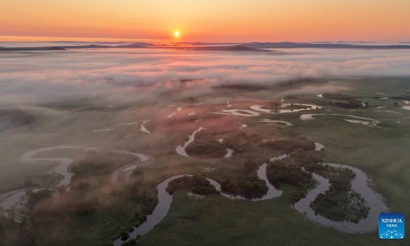 An aerial drone photo taken on Aug. 5, 2026 shows the sunrise at Nanwenghe National Nature Reserve in northeast China's Heilongjiang Province. In recent years, the number of migratory birds to Heilongjiang Province has rebounded thanks to sustained ecological efforts. Photo: Xinhua