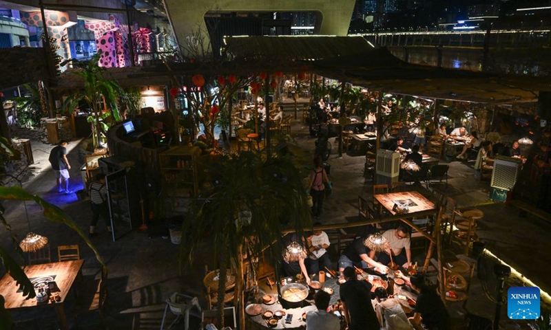 Residents enjoy hotpots under a bridge in Liangjiang New Area, southwest China's Chongqing, Aug. 13, 2026. In recent years, Liangjiang New Area has transformed vacant spaces under bridges into spaces for exercise and recreation. Photo: Xinhua