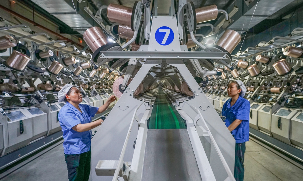 Workers operate alongside intelligent equipment at a chemical fiber company in Suqian, East China's Jiangsu Province, on August 16, 2026. The city has upgraded its high-end textile industry through technology and smart manufacturing, boosting both production quality and efficiency.
Photo: VCG