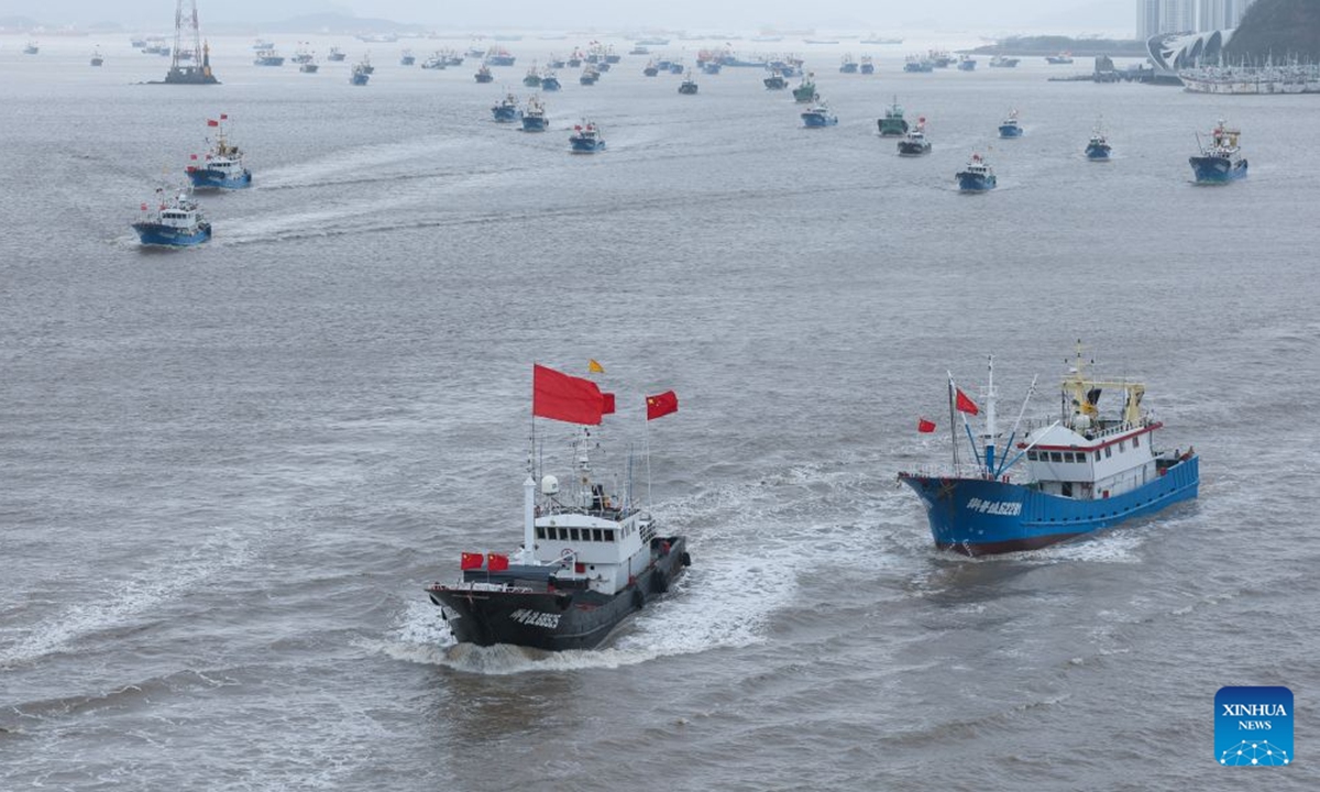 Fishing boats set sail for fishing from Shenjiamen Port in Zhoushan, east China's Zhejiang Province, Aug. 11, 2026. Four types of fishing boats with special permission set sail on Tuesday after a three-month summer fishing ban in the East China Sea. The opening of the fishing season was delayed from the originally scheduled Aug. 5 due to Typhoon Dolphin. (Xinhua/Xu Yu)