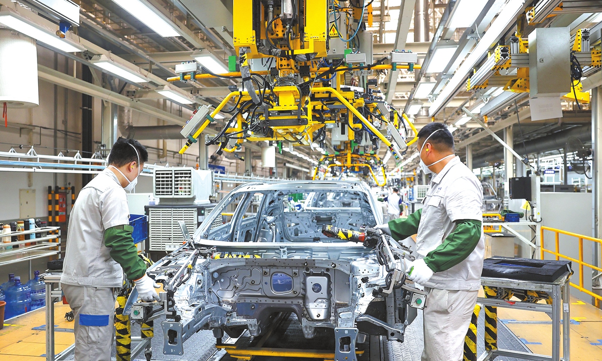 Workers operate in the welding workshop of FAW-Volkswagen's East China production base in Jimo district, Qingdao, East China's Shandong Province, on August 18, 2026. The base is located in a major automotive manufacturing cluster in Jimo, where producers of passenger, commercial and special-purpose vehicles are ramping up production to fill orders. Photo: VCG