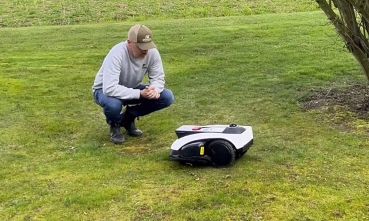 A MOVA robotic lawn mower operates on a lawn. Photo: Courtesy of NexLawn Intelligent Technology