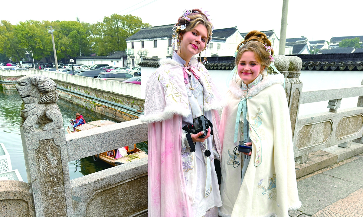 Foreign tourists wearing traditional Chinese hanfu visit Suzhou, East China's Jiangsu Province. Photo: VCG