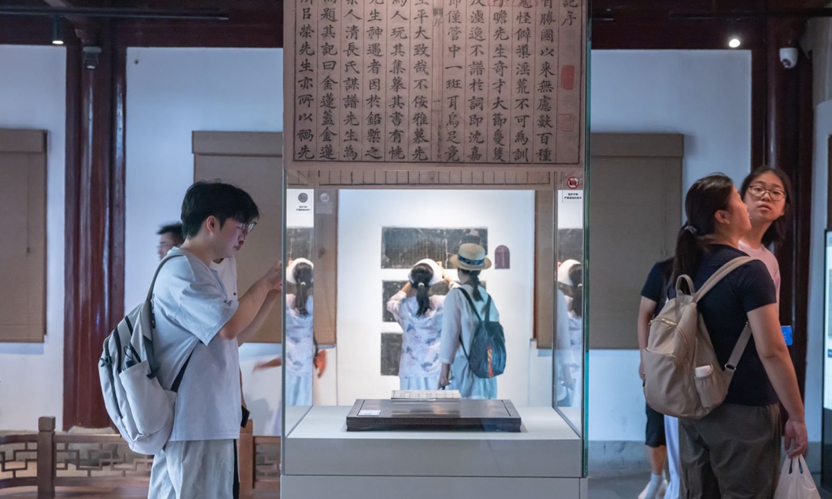 Visitors view ancient documents at Tianyige Museum. Photo: Courtesy of Tianyige Museum 