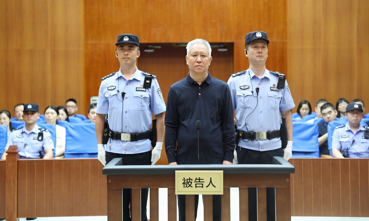 Former China Evergrande Group chairman Xu Jiayin stands in court during the first-instance verdict at the Shenzhen Intermediate People's Court in South China's Guangdong Province on August 20, 2026. Photo: CCTV News