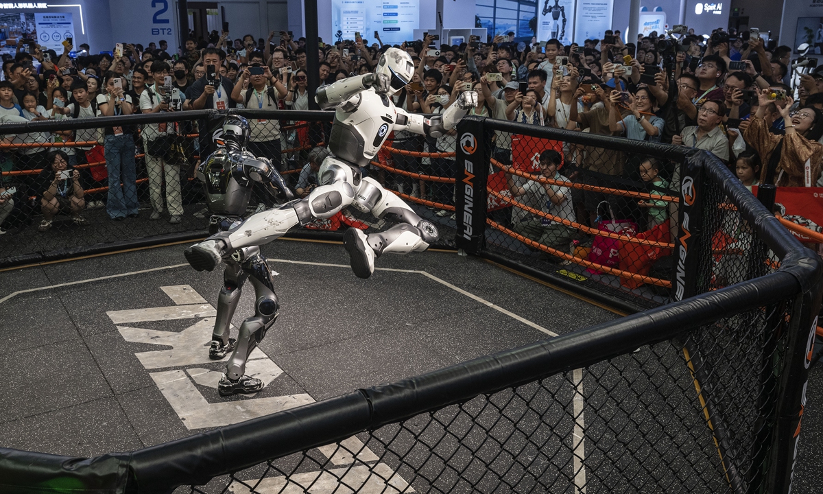A humanoid robot developed by Chinese company ENGINEAI competes in a robot combat match at the World Robot Conference in Beijing on August 20, 2026. Photo: VCG