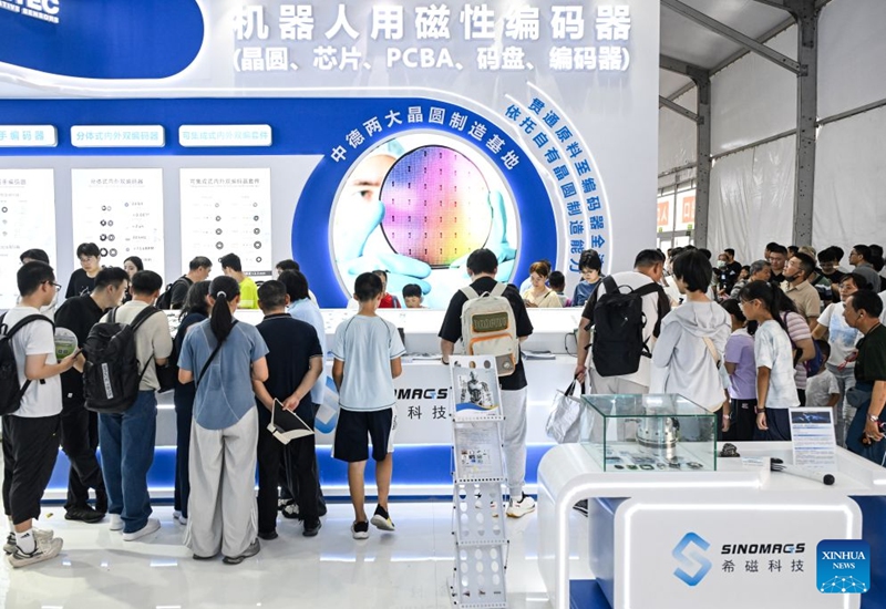 People visit the 2026 World Robot Conference in Beijing, capital of China, Aug. 22, 2026. The conference, which runs from Wednesday through Sunday, has drawn more than 300 exhibitors from 26 countries, with over 3,000 products on display, including more than 300 debuts. Many people visited the conference on Saturday, the first open day of the event. Photo: Xinhua