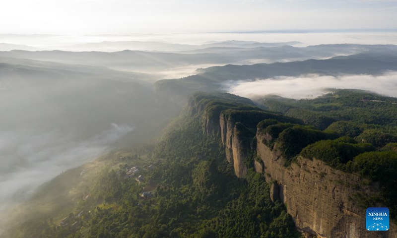 An aerial drone photo taken on Aug. 20, 2026 shows the Jianmen Pass shrouded in clouds and mist in Jian'ge County, Guangyuan City of southwest China's Sichuan Province. (Xinhua/Jiang Hongjing)