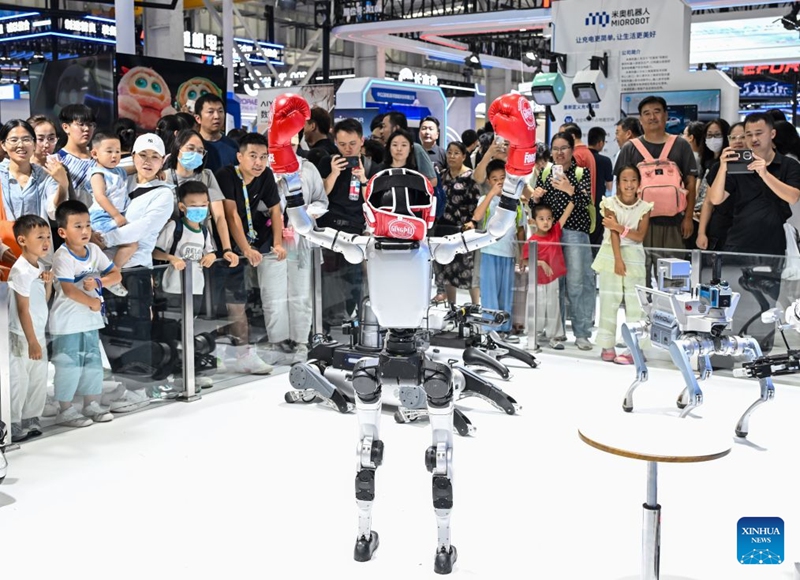 People visit the 2026 World Robot Conference in Beijing, capital of China, Aug. 22, 2026. The conference, which runs from Wednesday through Sunday, has drawn more than 300 exhibitors from 26 countries, with over 3,000 products on display, including more than 300 debuts. Many people visited the conference on Saturday, the first open day of the event. Photo: Xinhua