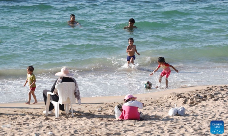 People cool off on a beach along the Mediterranean coast during a heatwave in Alexandria, Egypt, Aug. 22, 2026. (Xinhua/Ahmed Gomaa)