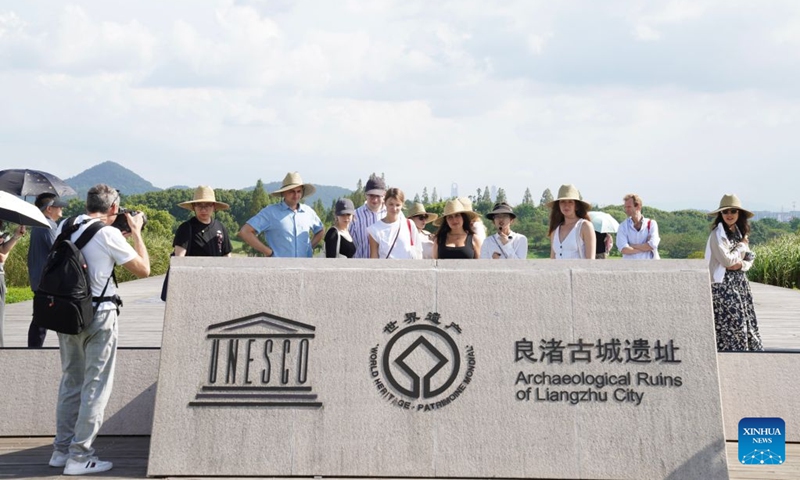 Members of a joint China-Russia media delegation visit the Archaeological Ruins of Liangzhu City Park in Hangzhou, east China's Zhejiang Province, Aug. 21, 2026. The delegation visited Hangzhou from Aug. 20 to 22, experiencing the charm of Chinese culture. (Xinhua/Lu Jinbo)