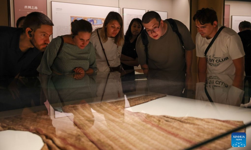 Members of a joint China-Russia media delegation visit the China National Silk Museum in Hangzhou, east China's Zhejiang Province, Aug. 20, 2026. The delegation visited Hangzhou from Aug. 20 to 22, experiencing the charm of Chinese culture. (Xinhua/Jiang Han)