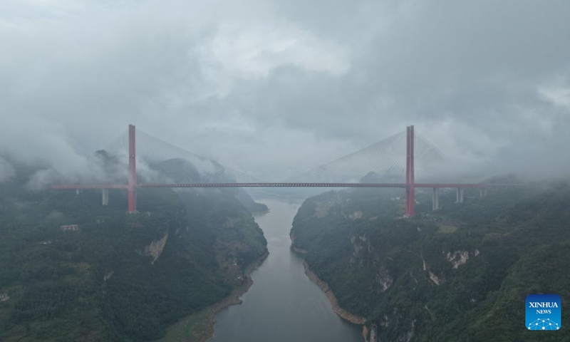 An aerial drone photo taken on Aug. 15, 2026 shows the Yachi River Bridge in the mist in southwest China's Guizhou Province. With a main span of 800 meters and a total length of 1,450 meters, the bridge serves as a key link connecting Bijie City and Guiyang City in southwest China's Guizhou Province. Photo: Xinhua