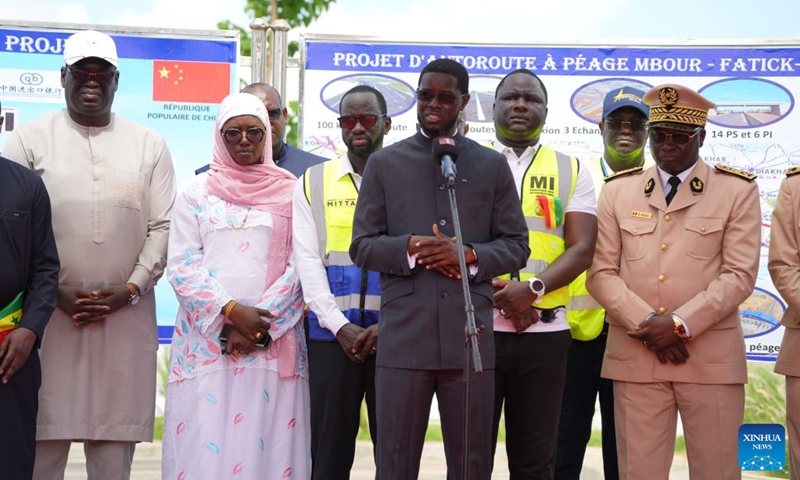 Senegalese President Bassirou Diomaye Faye (4th R) addresses the opening ceremony of the Mbour-Kaolack highway project in Thiadiaye, Mbour Department, in Senegal's western Thies Region, Aug. 22, 2026. The Mbour-Kaolack highway project, built by China Road and Bridge Corporation, opened to traffic on Saturday at a ceremony in Thiadiaye, Mbour Department, in Senegal's western Thies Region. (Xinhua/Qi Qi)
