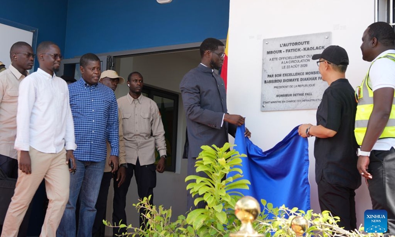 Senegalese President Bassirou Diomaye Faye (3rd R) unveils a plaque of the Mbour-Kaolack highway project in Thiadiaye, Mbour Department, in Senegal's western Thies Region, Aug. 22, 2026. The Mbour-Kaolack highway project, built by China Road and Bridge Corporation, opened to traffic on Saturday at a ceremony in Thiadiaye, Mbour Department, in Senegal's western Thies Region. (Xinhua/Qi Qi)