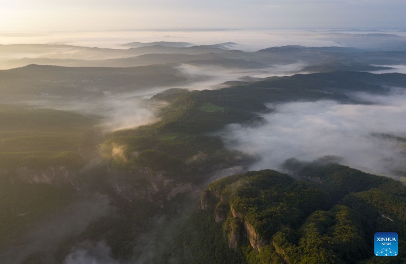 An aerial drone photo taken on Aug. 20, 2026 shows the Jianmen Pass shrouded in clouds and mist in Jian'ge County, Guangyuan City of southwest China's Sichuan Province. (Xinhua/Jiang Hongjing)