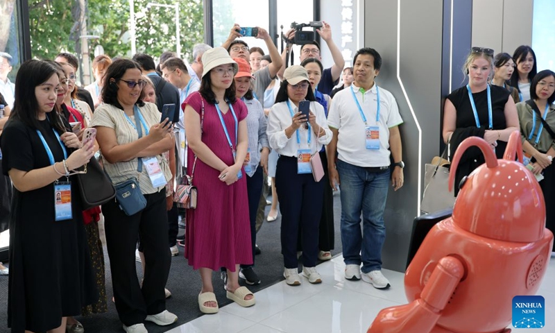Delegates attending the Third APEC Senior Officials' Meeting and Related Meetings visit a science and technology exhibition hall of Liaoyu Group in Dalian, northeast China's Liaoning Province, Aug. 22, 2026. The Third APEC Senior Officials' Meeting and Related Meetings are held here from Aug. 17 to 28. (Xinhua/Li Gang)