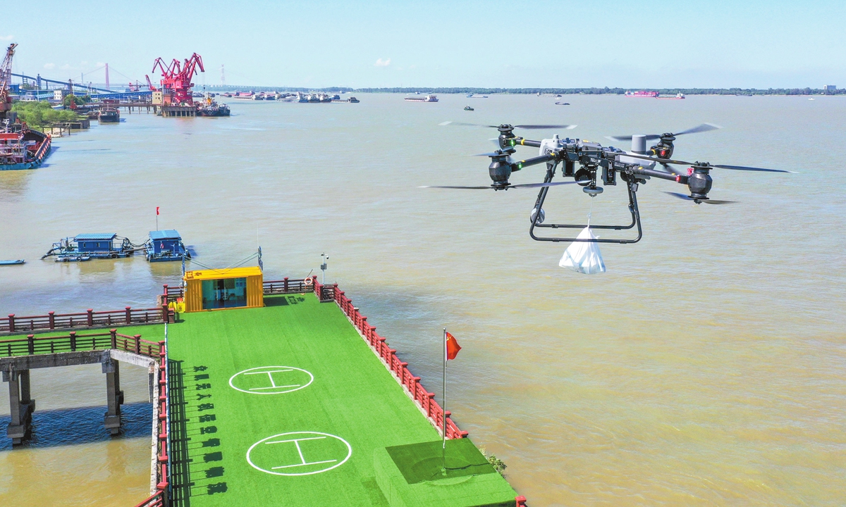 A drone carrying daily necessities takes off from a low-altitude smart logistics base to deliver supplies to vessels operating on the Yangtze River at a port in Tongling, East China's Anhui Province, on August 25, 2026. In recent years, the area has leveraged the opportunities presented by low-altitude economy and its strategic location along the Yangtze River to provide fast, drone-based delivery of supplies to passing vessels. Photo: VCG