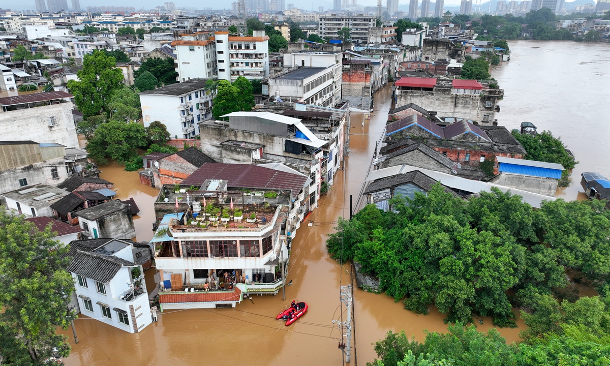 A rescue boat is seen moves through a flooded area in Longzhou, South China's Guangxi Zhuang Autonomous Region, on August 24, 2026, after heavy rainfall brought by Typhoon Narra and upstream inflows caused water levels along the Zuojiang River to rise. Photo: VCG