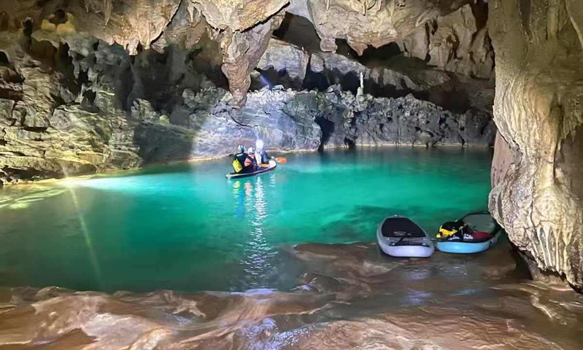 A cave exploration team paddles through Shilong Cave in Southwest China's Guizhou Province. Photo: Courtesy of Jiang Jun 