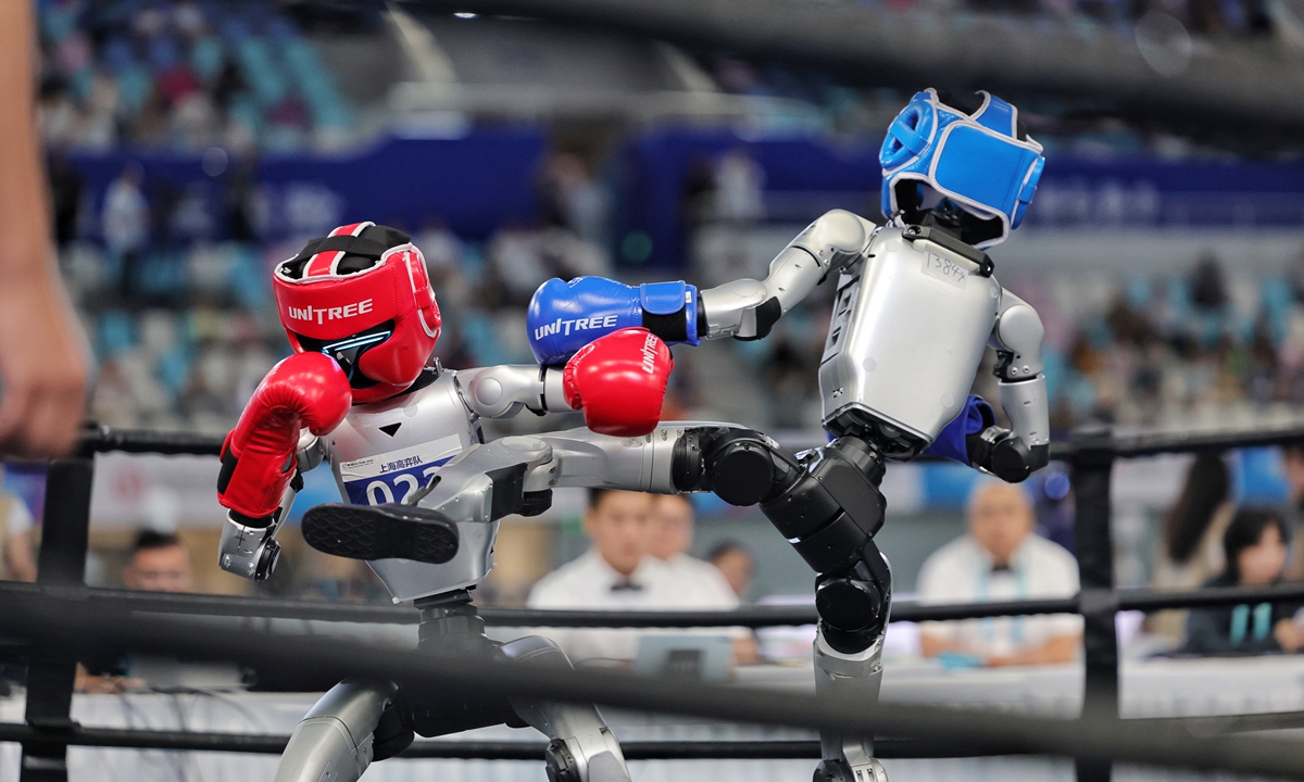 Humanoid robots compete in a freestyle fighting match at the 2nd World Humanoid Robot Games in Beijing on August 26, 2026. Photo: Li Hao/GT