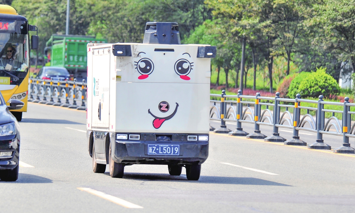 A self-driving express delivery vehicle operates in Huanghua Town, Yichang, Central Hubei Province on August 26, 2026. In recent years, the area has deployed autonomous delivery vehicles to assist with parcel delivery in rural townships. The initiative has effectively addressed the challenges of low delivery frequency and limited transportation capacity in rural areas. Photo: VCG