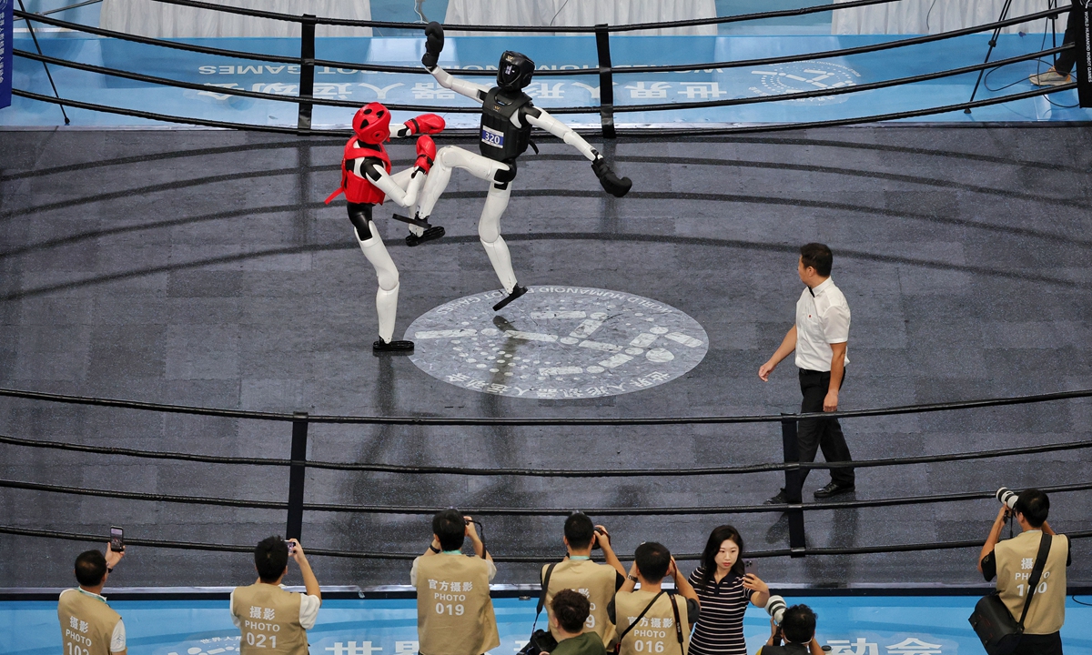 Humanoid robots compete in a freestyle fighting match at the 2nd World Humanoid Robot Games in Beijing on August 26, 2026. Photo: Li Hao/GT