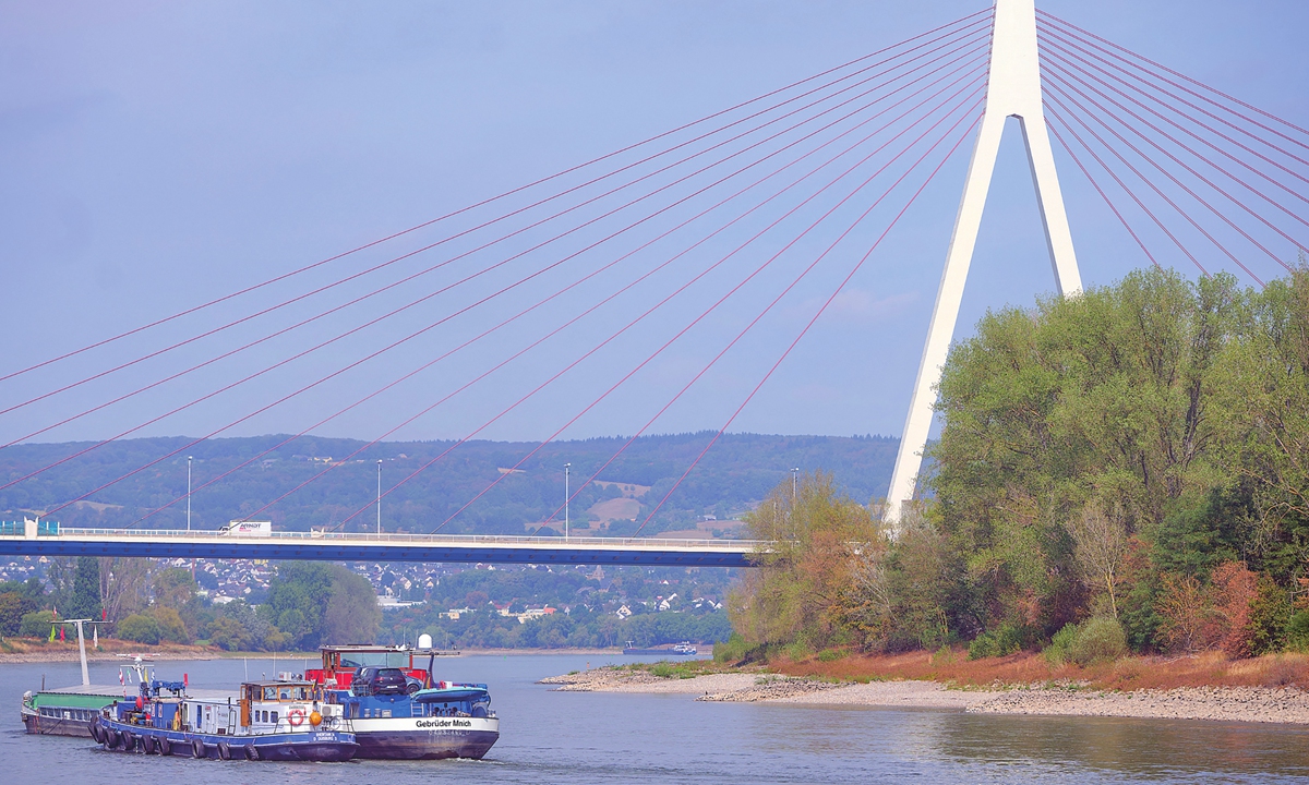 Cargo ships sail on the Rhine River near Wei?emthurm Bridge, Germany, on August 26, 2026. The rain over the past few days and the resulting rise in the Rhine's water level have led to a slight increase in traffic on the Rhine. Photo: VCG