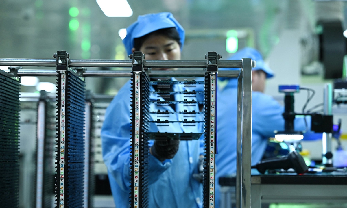 A technician conducts chip quality inspections in a factory in Yiwu, East China's Zhejiang Province, in March 2026. Photo: VCG