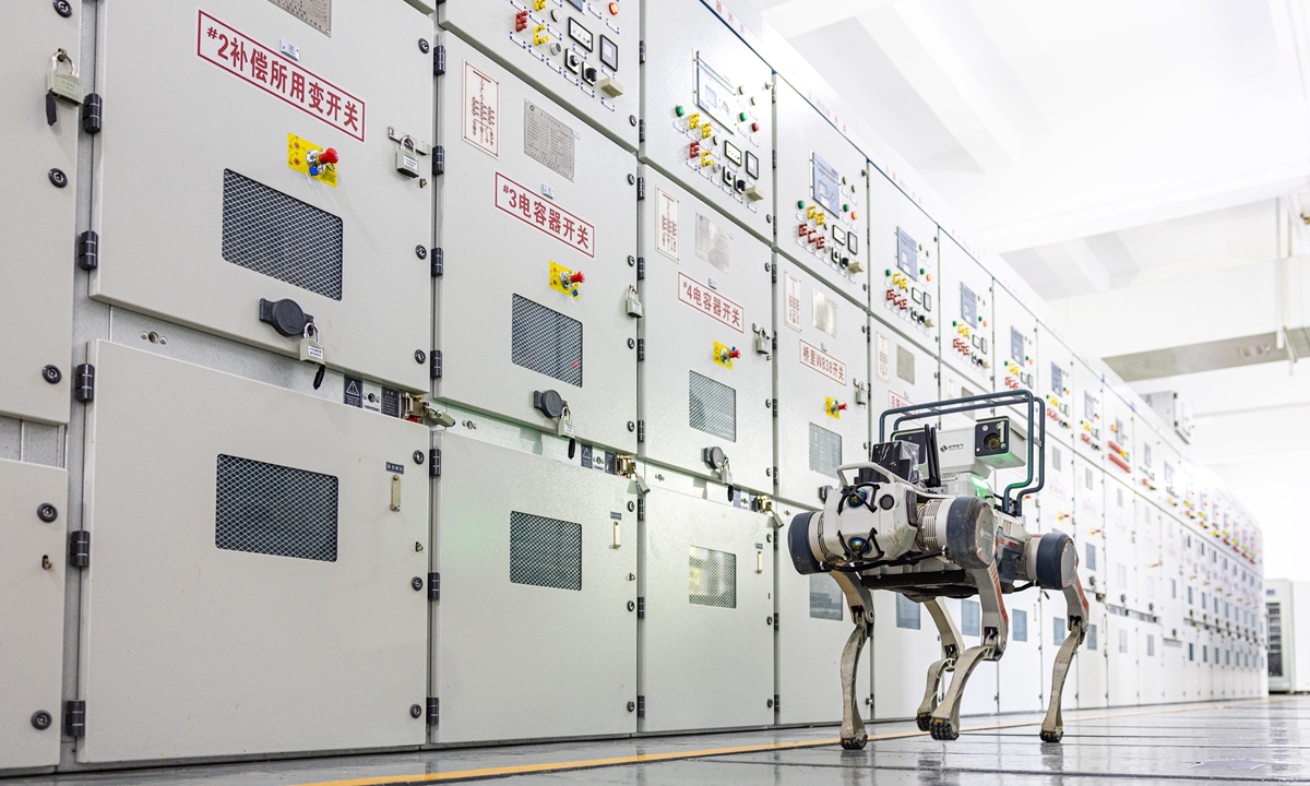 An intelligent inspection robot dog inspects power switch cabinets at a substation in Wenling, East China's Zhejiang Province, on August 27, 2026. It performs full?coverage checks on core equipment such as main transformers, busbars and switch cabinets inside substation distribution rooms. Photo: VCG