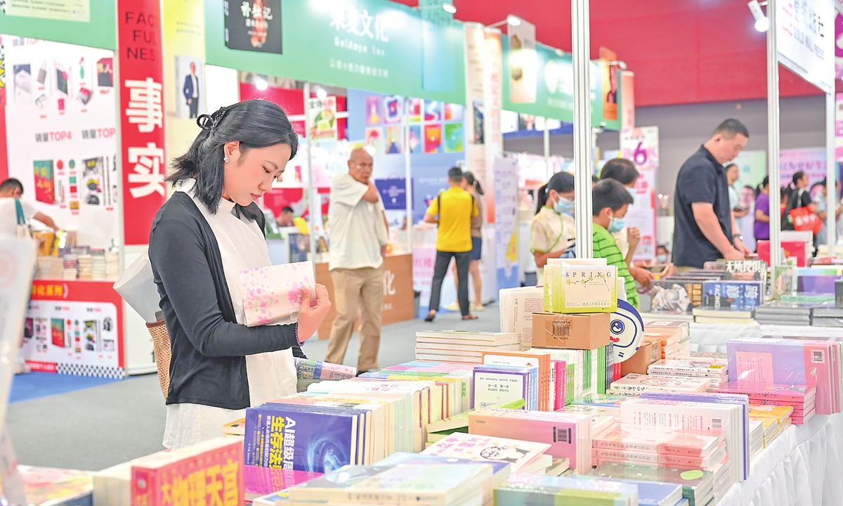 A reader browses books in an exhibition area of the China Import and Export Fair Complex in Guangzhou, South China's Guangdong Province, where the 2026 South China Book Festival is being held, on August 27, 2026. Nearly 30,000 titles of overseas original-language books, along with more than 500,000 varieties of cultural and creative products, are on display at the festival. Photo: VCG