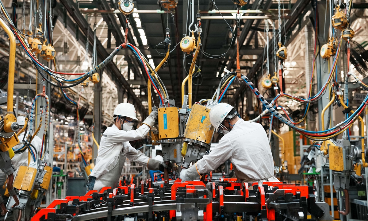 Workers assemble NEVs in Liuzhou, South China's Guangxi Zhuang Autonomous Region, on July 8, 2026. Photo: VCG