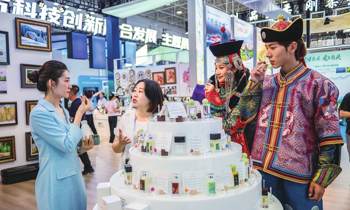 Visitors try perfumes at an exhibition booth at the 10th Inner Mongolia Autonomous Region Cultural Industries Expo Fair in Hohhot, North China's Inner Mongolia Autonomous Region, on August 27, 2026. Photos on this page: VCG