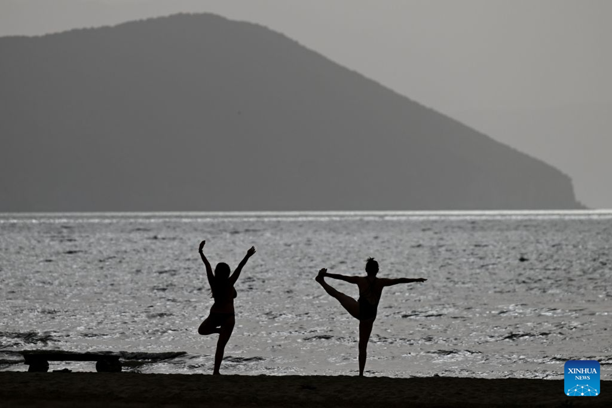 People enjoy themselves at the shore of Prespa Lake, Resen, North Macedonia, Aug. 28, 2026. Temperatures soar as a heatwave grips the region, with hot summer conditions prevailing across the area. (Photo by Tomislav Georgiev/Xinhua)