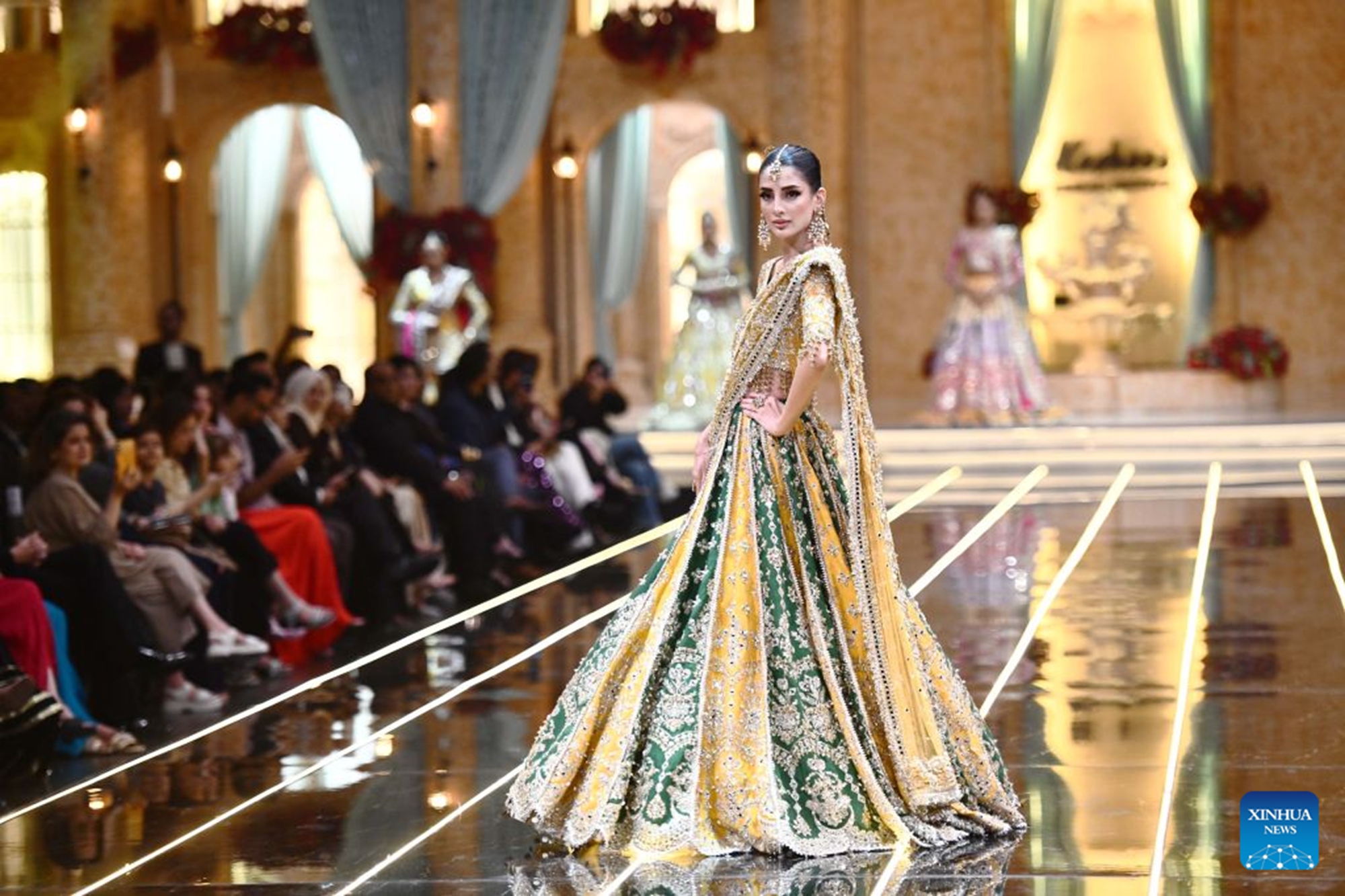 A model presents a bridal creation during a fashion show in southern Pakistani port city of Karachi on Aug. 28, 2026. (Str/Xinhua)