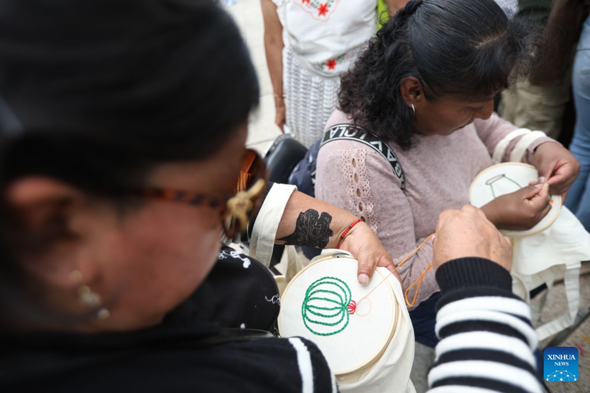Women make nopal-themed embroidery at the Nopal Fair 2026 in Mexico City, capital of Mexico, on Aug. 28, 2026. The event opened here on Friday. The three-day event brings together 140 producers to showcase and sell nopal and processed nopal products, as well as cultural and educational activities. (Photo by Francisco Canedo/Xinhua)