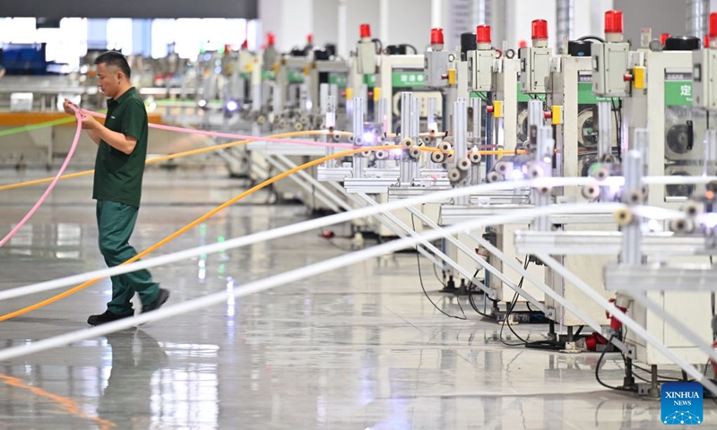 A worker works at a smart workshop of a building materials company in north China's Tianjin Municipality, Aug. 28, 2026. In recent years, Beichen District in Tianjin has leveraged technological innovation to upgrade its industries, developing 60 smart factories across sectors including light manufacturing, new materials and high-end equipment. Photo: Xinhua